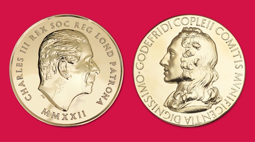 Two gold medals on a red background