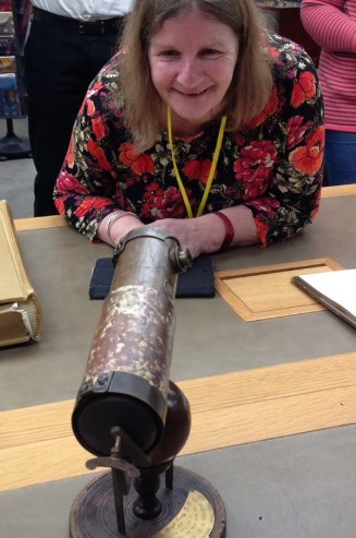 Sarah with the first reflective telescope.