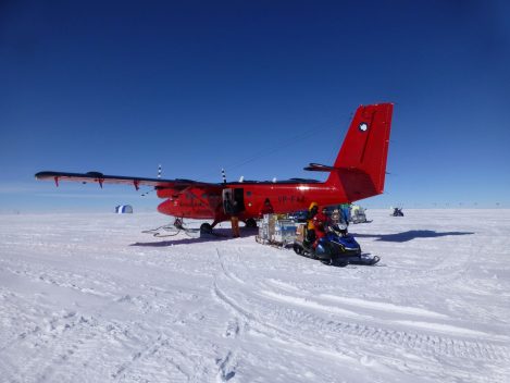 Unloading science cargo from a British Antarctic Survey Twin Otter plane