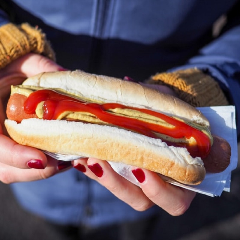 1.	Photo of a person holding a hot dog, taken by Peter Secan. Available from Unsplash (https://unsplash.com/photos/kKXBw9Exn30).