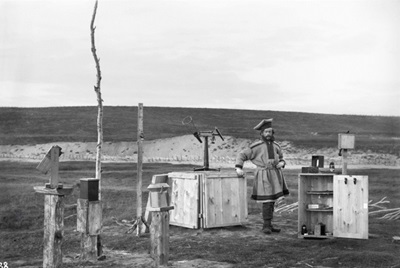 Sophus Tromholt, ‘Sophus Tromholt in Sami costume standing among the instruments in his outdoor observatory at Kautokeino’, 1882–3, University of Bergen Library, ubb-trom-038.