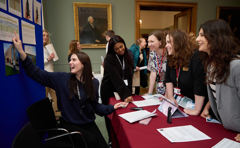 A Partnership Grant project student explaining their research to guests of the student conference.