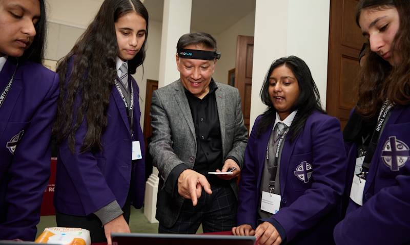 Partnership Grant students explaining their research project to Professor Saiful Islam.