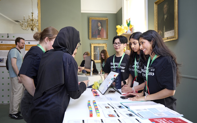 Young Researcher Zone students presenting their research project to visiting school children 