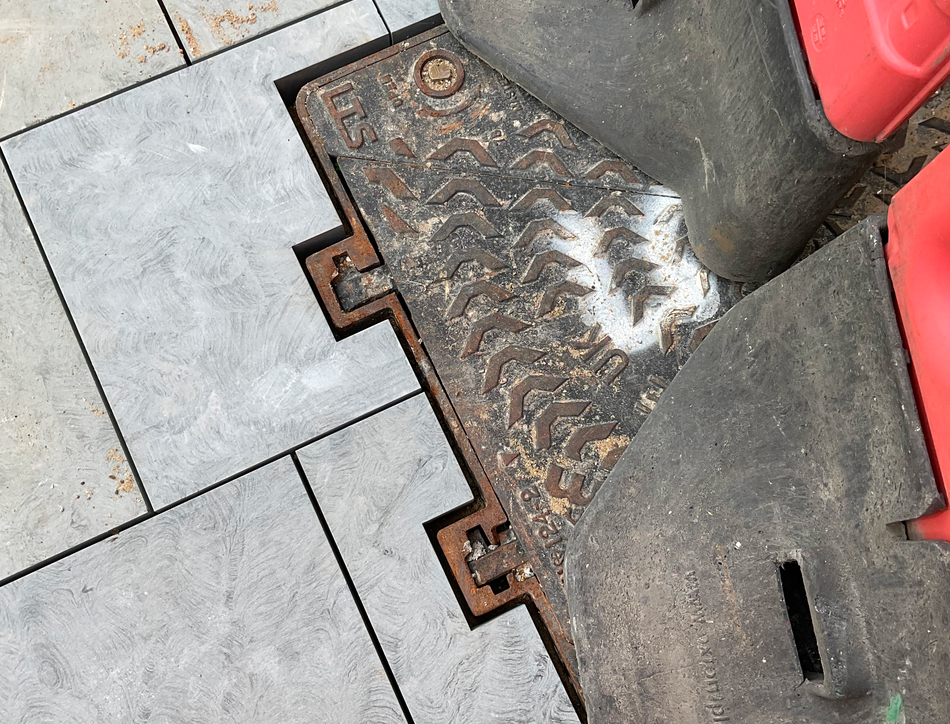 Example of drain covers which require paving to be fit around these complex shapes.