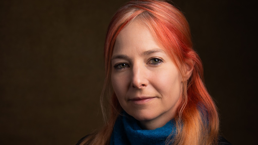 Alice Roberts in front of a black background