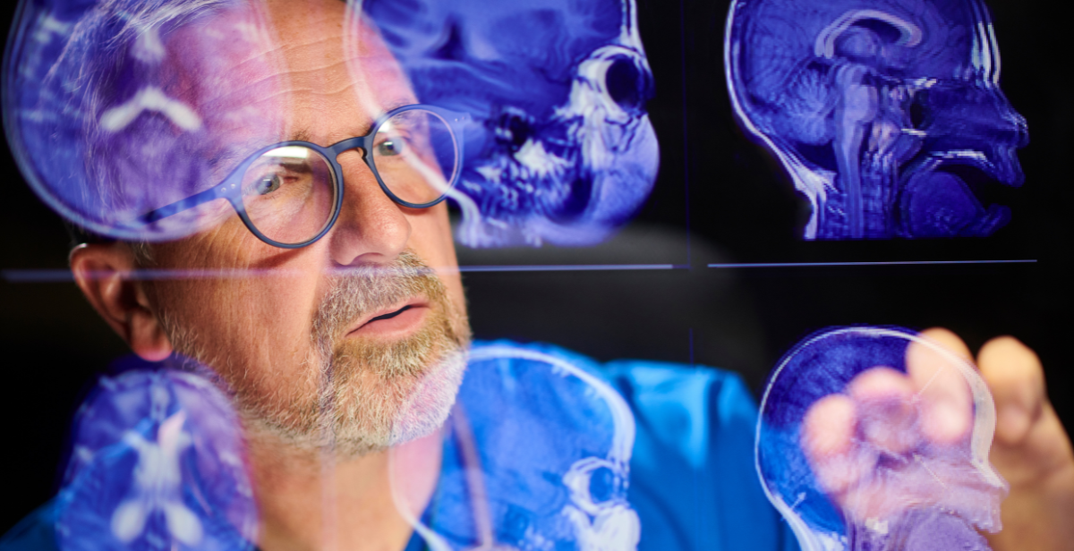 Surgeon analysing scans