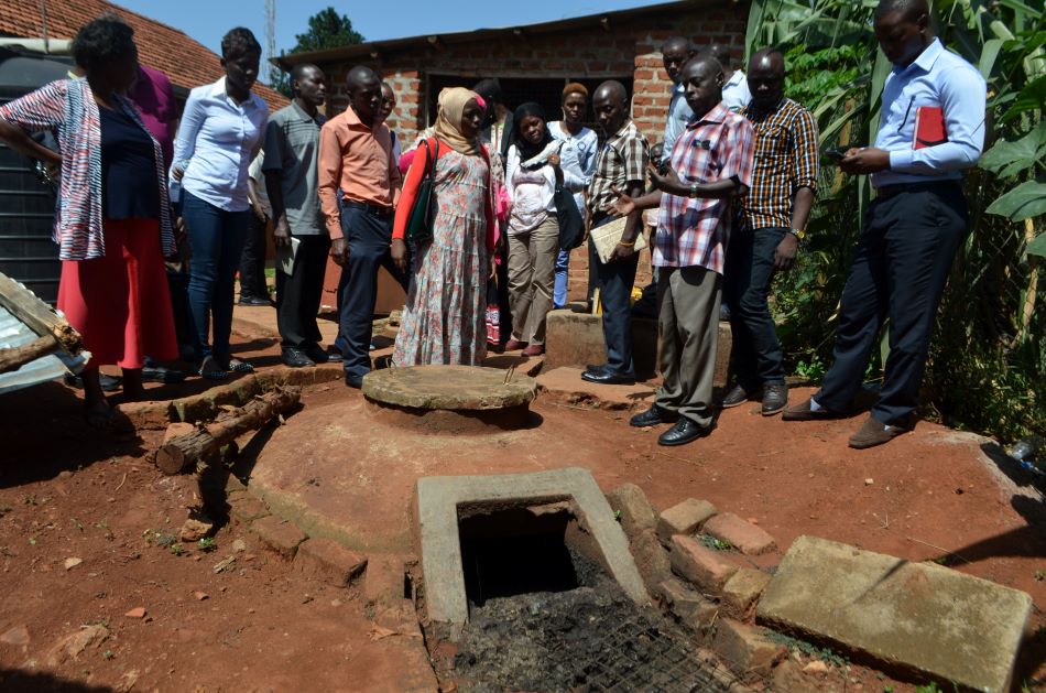 Image: Stakeholders visit a biogas plant at Sanyu babies' home in Uganda. This was part of an ACERA training on bio-energy technologies in 2017. The field visit demonstrated to the trainees the functionality of a biogas plant. The visit also enabled the operators to discuss how they have managed to maintain the plant, providing tips on how to overcome the challenges of operation.