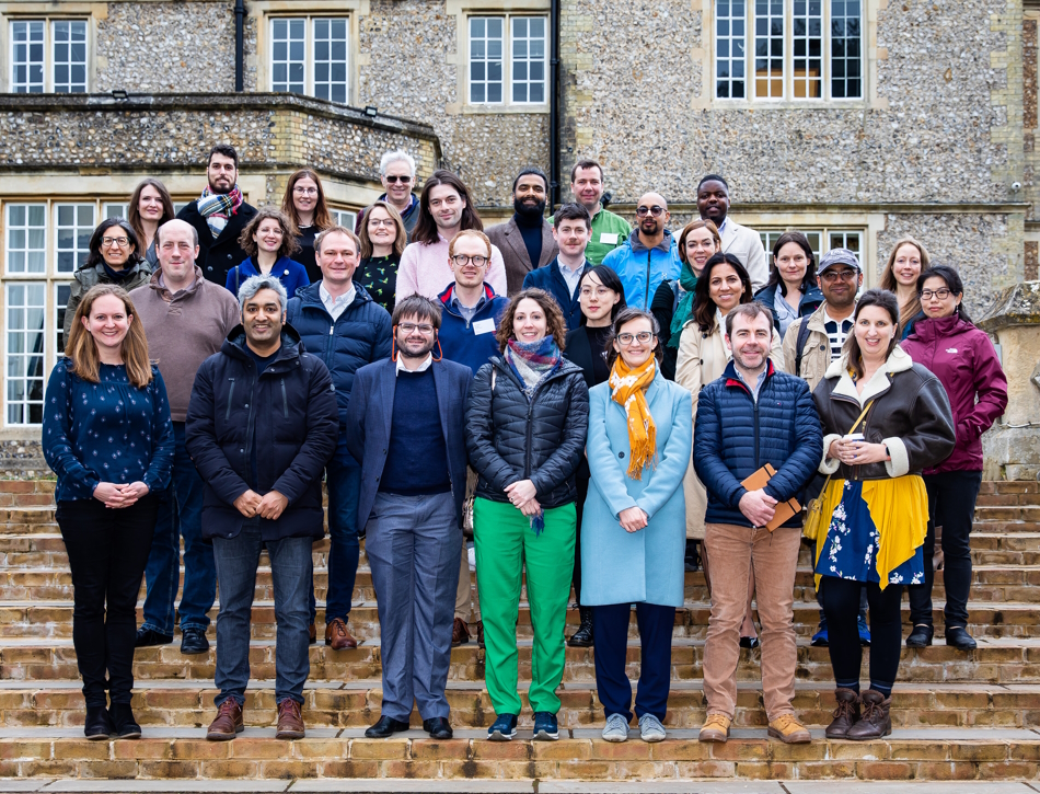 A group of course delegates standing on steps at the Policy Primer in 2023