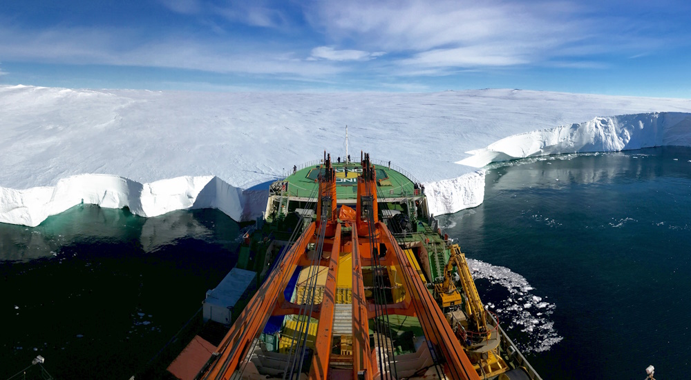 The Russian research vessel Akademik Tryoshnikov leans the bow against the Mertz Glacier.