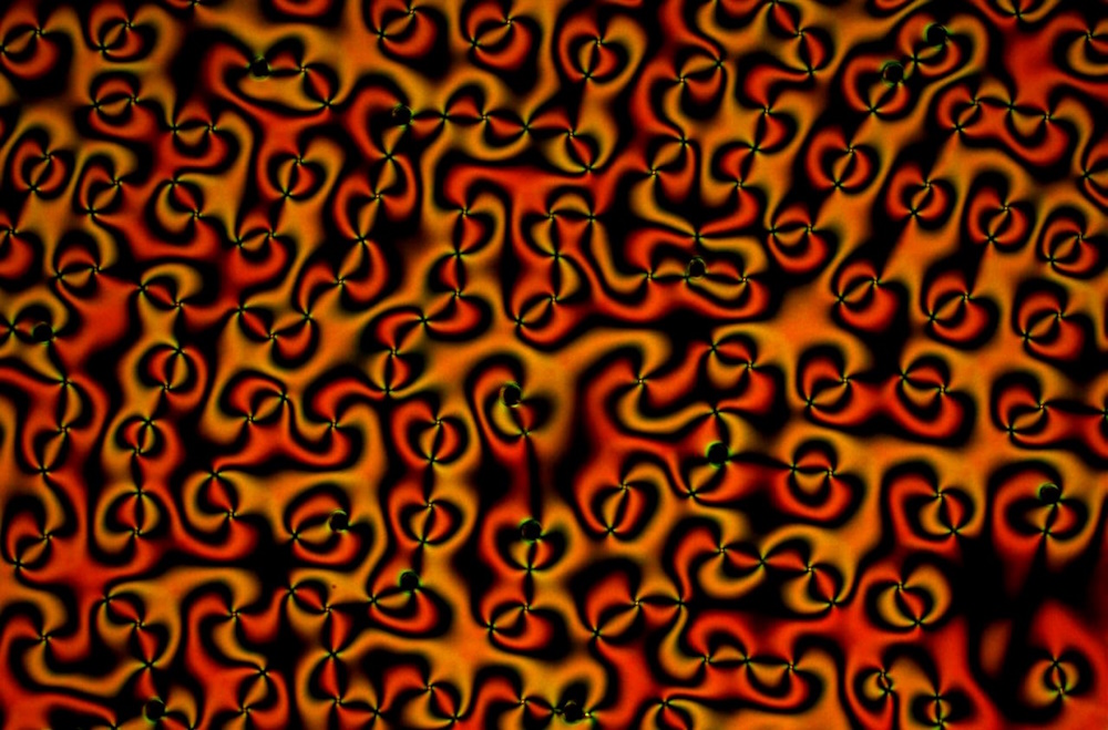 A pattern of red and yellow vortexes.