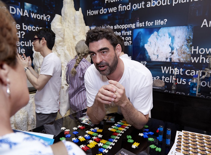 Dr Nick Lane, a biochemist and writer from UCL, speaks to a member of the public at the Royal Society Summer Science Exhibition.
