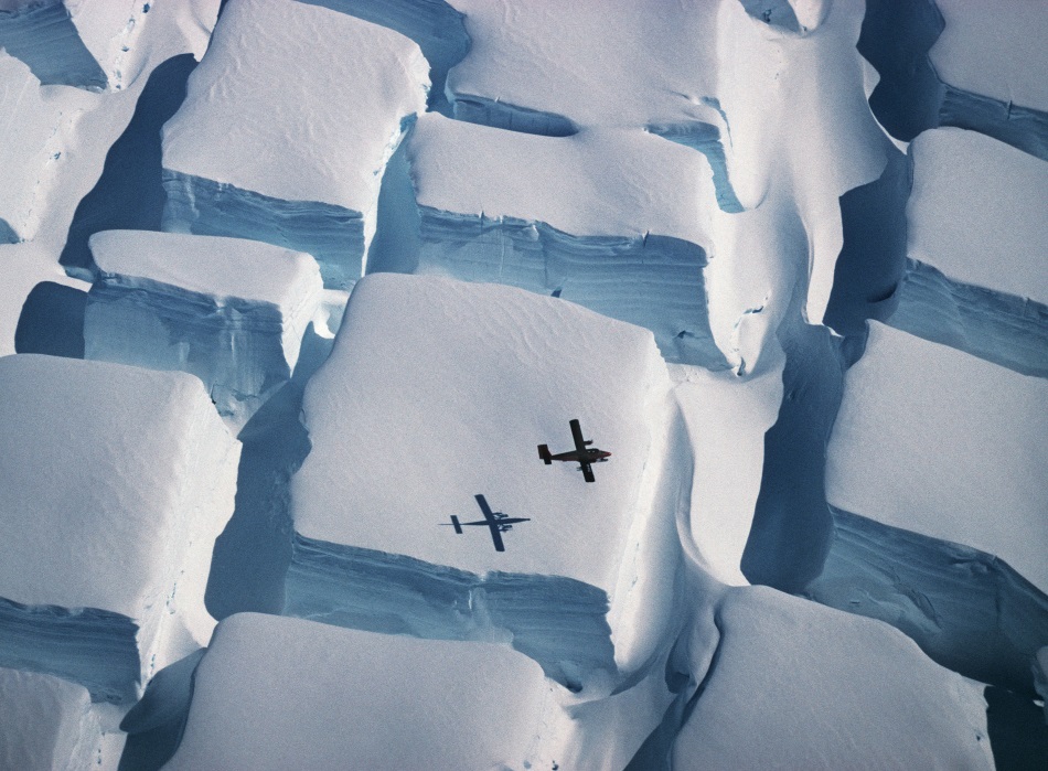 Plane flying over Antarctica, by Peter Convey