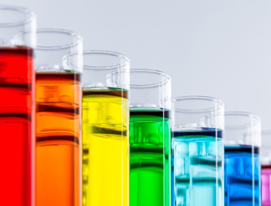 Test tubes with brightly coloured liquid.