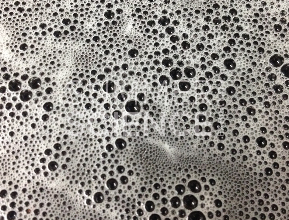Summer Science Exhibition: bubbles on the surface of a dark liquid