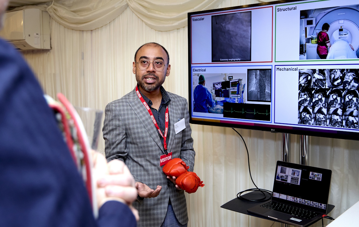 Picture of Dr Abhirup Banerjee holding a heart model