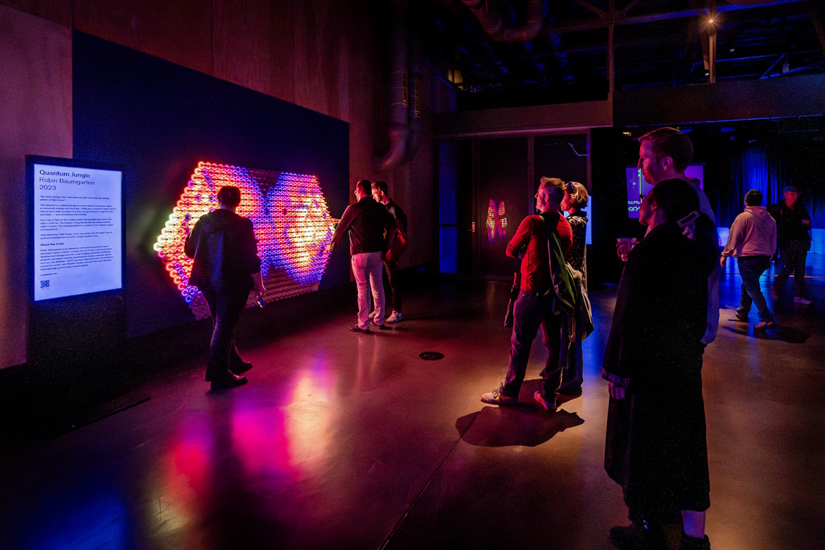 People interacting with Quantum Jungle exhibit